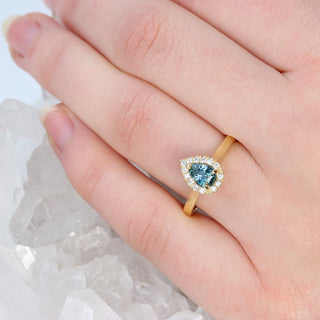 Custom Teal Sapphire and Diamond Halo Engagement Ring in 18ct Gold