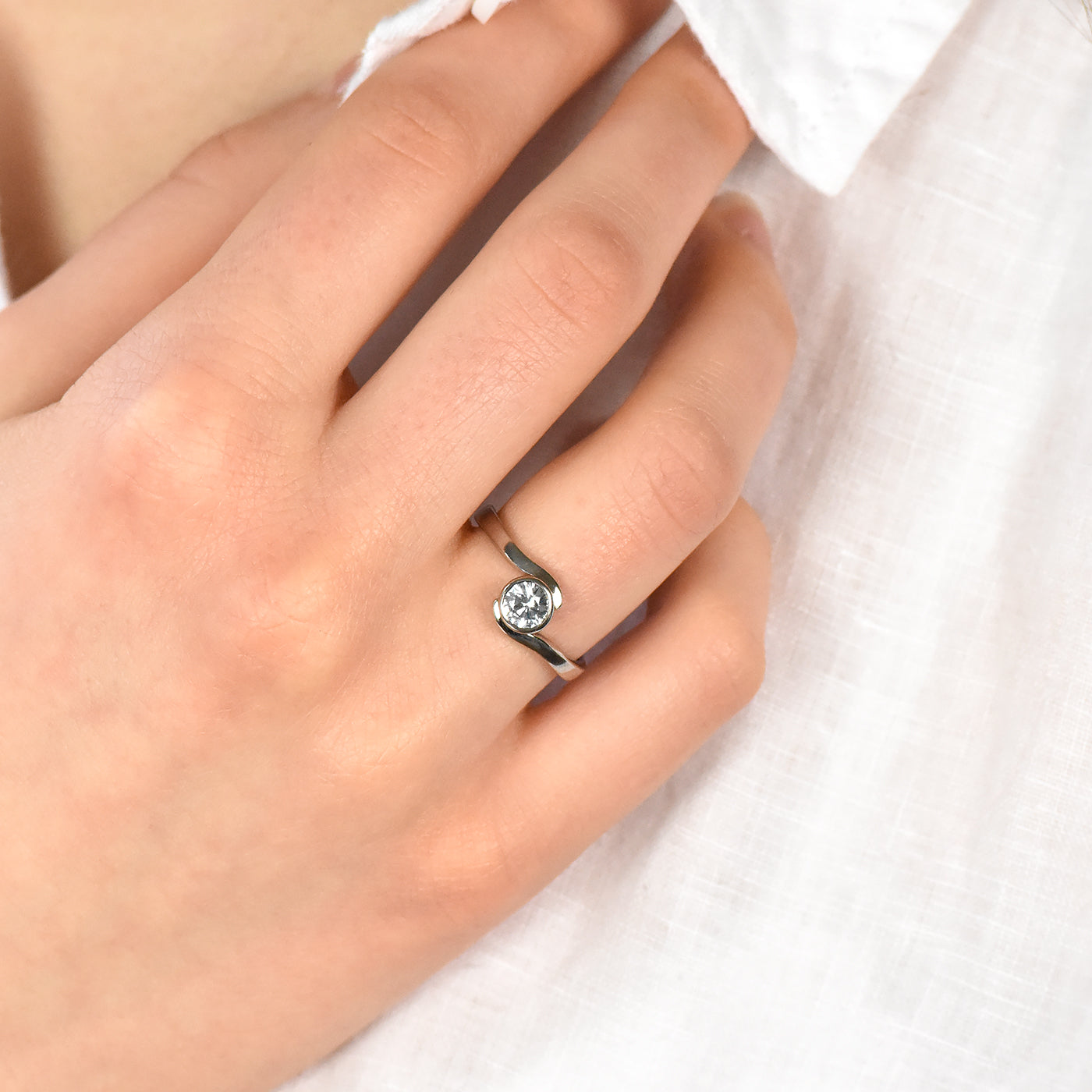 white sapphire swirl ring