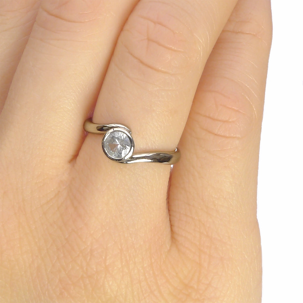 White Sapphire Ring in Swirl Design, on the hand