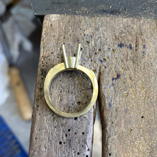 Handmade 18ct gold engagement ring band in progress, bespoke sapphire cluster design.