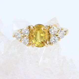 Bespoke oval yellow sapphire and diamond cluster engagement ring handmade in UK.